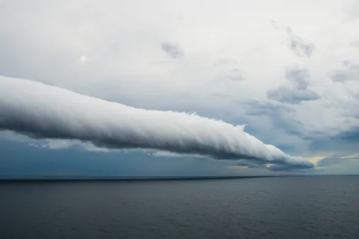 Tube-shaped Roll Cloud in the sky showcasing convection and temperature inversion